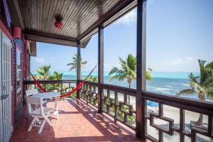 a balcony with a view of the ocean at X'tan Ha- The Waterfront in San Pedro