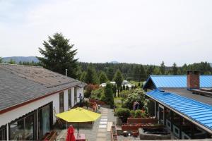 an overhead view of a building with a yellow umbrella at Timberlodge RV & Campground in Port Alberni