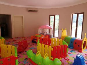 a childs play room with a toy playground at Hamsikoy Hotel in Hamsikoy