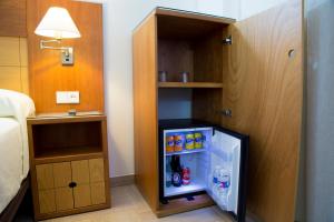 Postel nebo postele na pokoji v ubytování Hotel Córdoba Centro