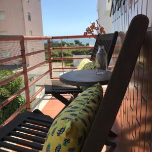 a balcony with a table and chairs on a balcony at Varandas da Sandia in Vila Praia de Âncora