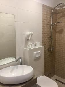 a bathroom with a toilet and a shower at Belveder Deluxe Suite and Rooms in Supetarska Draga +16 photos