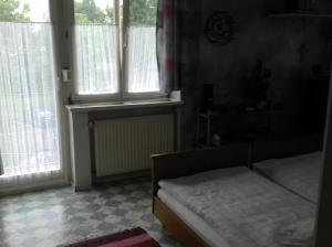 A bed or beds in a room at Gasthof Paradiesgartl
