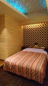 Krevet ili kreveti u jedinici u okviru objekta Hotel Eris Hakata (Love Hotel)
