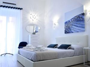 Postel nebo postele na pokoji v ubytování Duca70 "Suite Home"