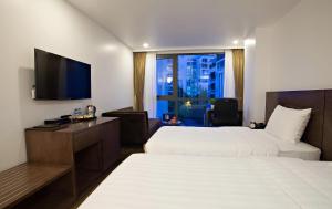 Postel nebo postele na pokoji v ubytování Inearth Hotel + 37 fotografií