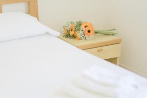 Postel nebo postele na pokoji v ubytování Albergo Marla