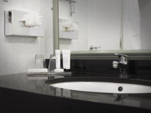 a bathroom with a sink and a mirror at HYDE Hotel in Galway