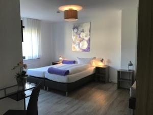 Postel nebo postele na pokoji v ubytování Hotel Hegemann garni