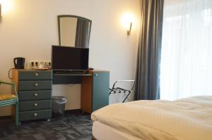 Postel nebo postele na pokoji v ubytování Hotel B8 Voerde