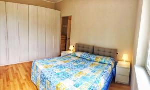Postel nebo postele na pokoji v ubytování Oleandro 2 apartment in Villa Cerutti