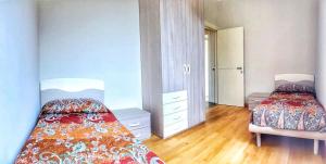 Postel nebo postele na pokoji v ubytování Oleandro 2 apartment in Villa Cerutti