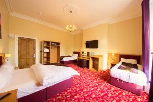 Postel nebo postele na pokoji v ubytování Edgerton Hotel