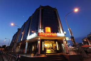 a building with a lit up sign on it at The Imperial Hotel in Kluang