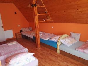 Postel nebo postele na pokoji v ubytování Agávé Apartman