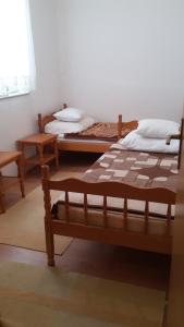 Postel nebo postele na pokoji v ubytování Orebic Garden House