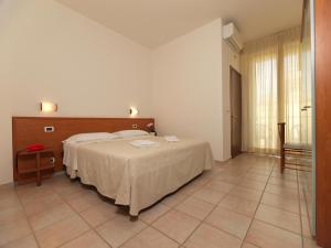 Postel nebo postele na pokoji v ubytování Hotel Florence