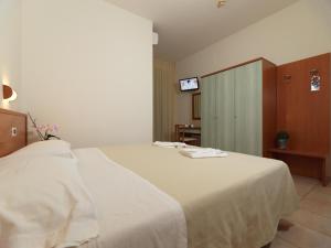 Postel nebo postele na pokoji v ubytování Hotel Florence