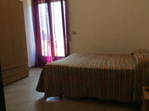 Postel nebo postele na pokoji v ubytování Hotel Rezia