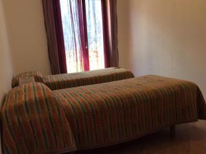 Postel nebo postele na pokoji v ubytování Hotel Rezia