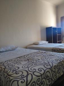 Postel nebo postele na pokoji v ubytování BB Homestay Two