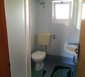 Koupelna v ubytování Apartments Bodi