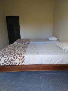 Postel nebo postele na pokoji v ubytování BB Homestay Two