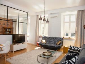 a living room with a couch and a table at BC7 Apartments in Krakow