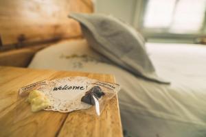 Rúm í herbergi á Innata Casa Hostal