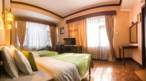 Cama ou camas em um quarto em Hotel Excelsior