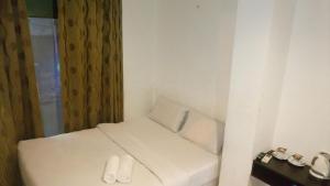 Postel nebo postele na pokoji v ubytování T-Hotel Bukit Bintang