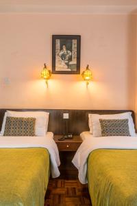 Cama ou camas em um quarto em Hotel Excelsior