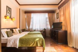 Cama ou camas em um quarto em Hotel Excelsior