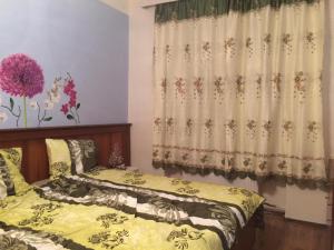 Postel nebo postele na pokoji v ubytování Blue Rose Apartman