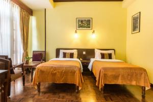 Cama ou camas em um quarto em Hotel Excelsior