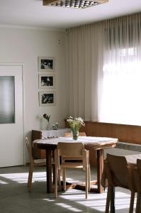 a dining room with a table and chairs at Vinni Hostel in Vinni