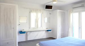 Postel nebo postele na pokoji v ubytování Evriali Beachfront