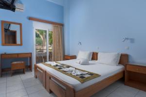 Posteľ alebo postele v izbe v ubytovaní Vlycha Beach Apartments