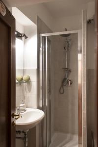 a bathroom with a sink and a shower at Sui Tetti di Napoli in Naples +43 photos