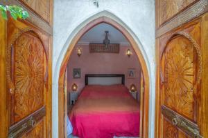Postel nebo postele na pokoji v ubytování Riad & Spa Laurence Olivier