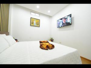 מיטה או מיטות בחדר ב-Hanoi Golden Hostel