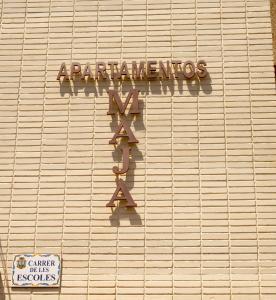 a sign on the side of a building at Apartamentos Maja in Benidorm
