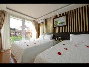 Postel nebo postele na pokoji v ubytování Hanoi Golden Hostel + 37 fotografií