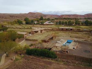 a large building with a lot of dirt on the ground at Lodge Altitud in San Pedro de Atacama