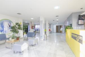 a lobby of a hospital with a waiting room at Albergue Inturjoven Granada in Granada