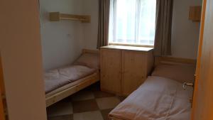 Postel nebo postele na pokoji v ubytování Dům bratří Čapků