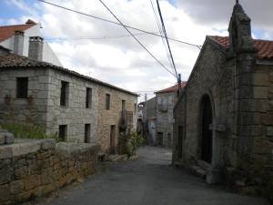 an alley in an old stone building at Casa da Bemposta in Bemposta +5 photos