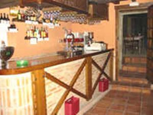 a kitchen with a counter with a sink in it at Casa Rural Corvina in Acebo