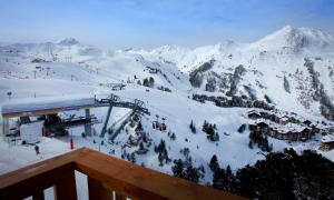 a view of a ski resort with snow covered mountains at Chalet des Neiges -La Source des Arcs in Arc 2000