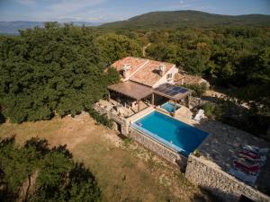 an overhead view of a house with a swimming pool at Villa Zamelinjak in Vrbnik